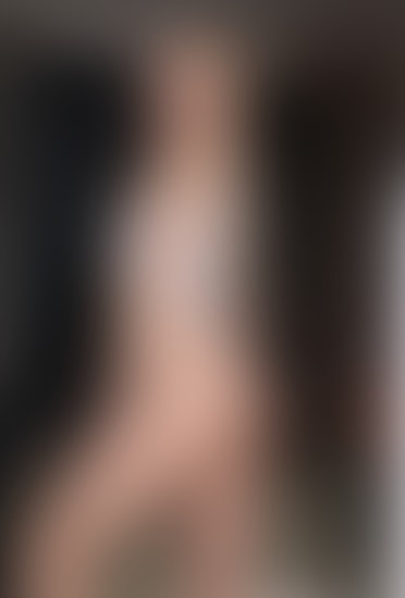 Leila Vale in white bodysuit